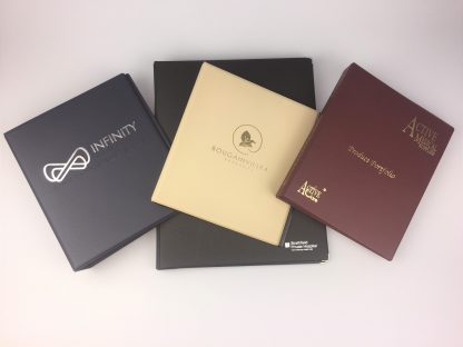 Corporate Branding Specialist Plastics Unique makes a wide range of branded stationery including these ring binders in a wide range of colours, fabrics. and prints